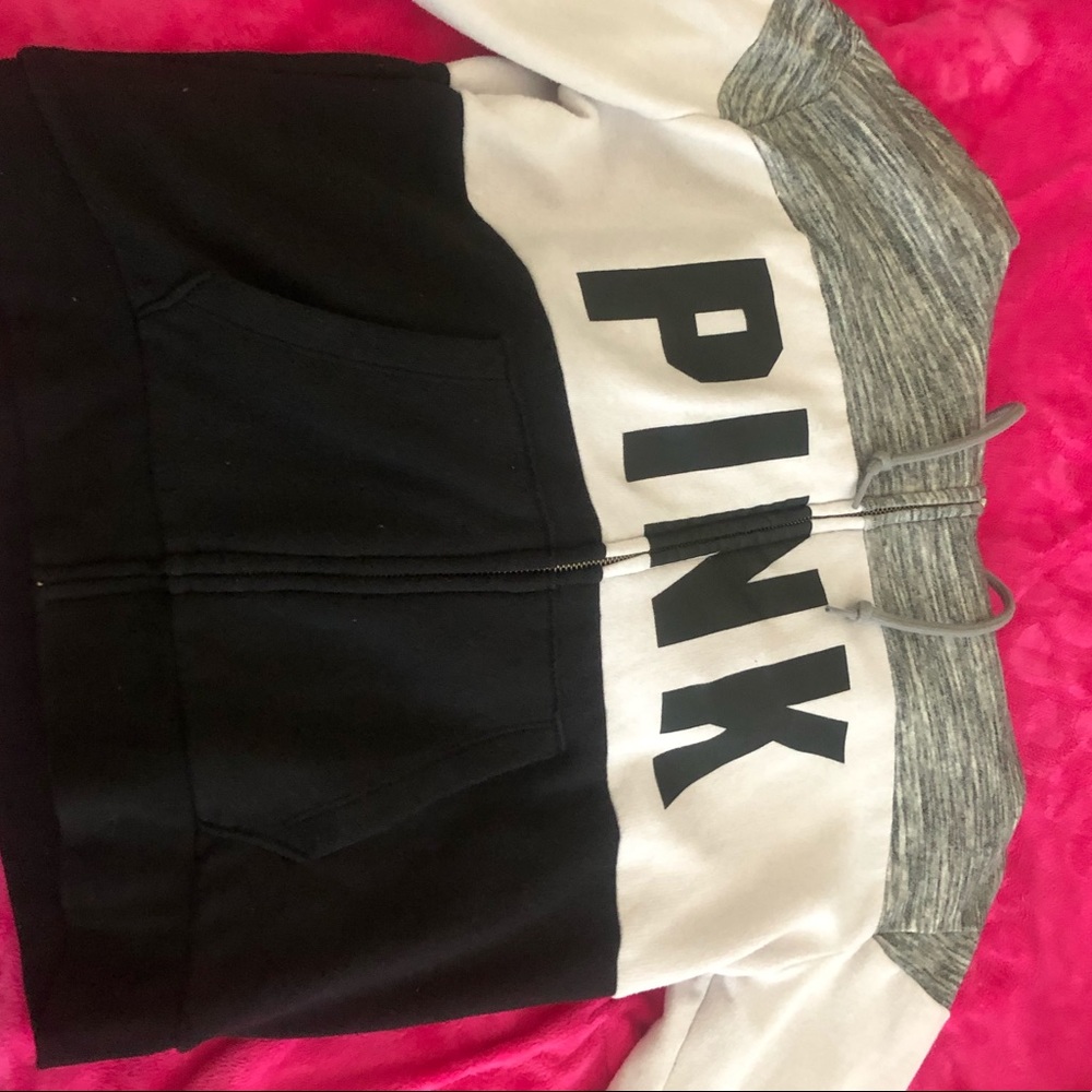 Pink multicolored black, grey, and white zip-up